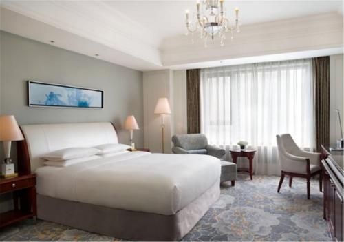 Imagen de la habitación del Hotel Courtyard By Marriott Shanghai Fengxian. Foto 9