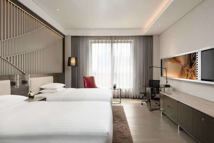 Imagen de la habitación del Hotel Courtyard By Marriott Tianjin Hongqiao. Foto 9