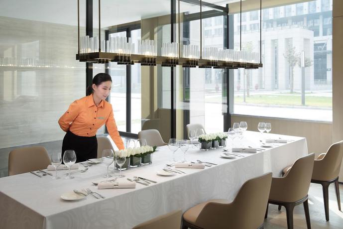 Imagen del bar/restaurante del Hotel Courtyard By Marriott Zhengzhou Airport. Foto 3