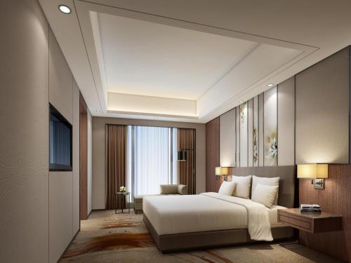 Imagen de la habitación del Hotel Courtyard By Marriott Zhengzhou East. Foto 8