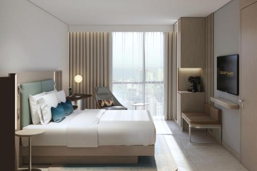 Imagen de la habitación del Hotel Courtyard by Marriott Dakar Diamniadio. Foto 17