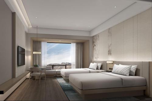 Imagen de la habitación del Hotel Courtyard by Marriott Jiuzhaigou. Foto 7