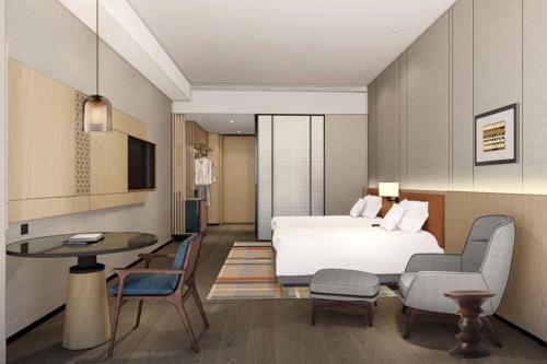 Imagen de la habitación del Hotel Courtyard by Marriott Nanning Wuxiang. Foto 9