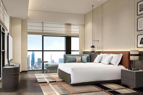 Imagen de la habitación del Hotel Courtyard by Marriott Nanning Wuxiang. Foto 11