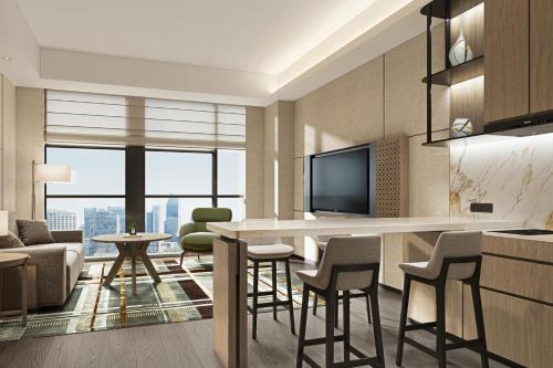 Imagen de la habitación del Hotel Courtyard by Marriott Nanning Wuxiang. Foto 12