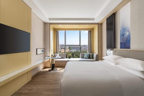 Imagen de la habitación del Hotel Courtyard by Marriott Shanwei Haifeng. Foto 19