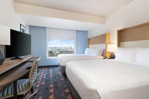 Imagen de la habitación del Hotel Courtyard by Marriott across Universal Orlando. Foto 16