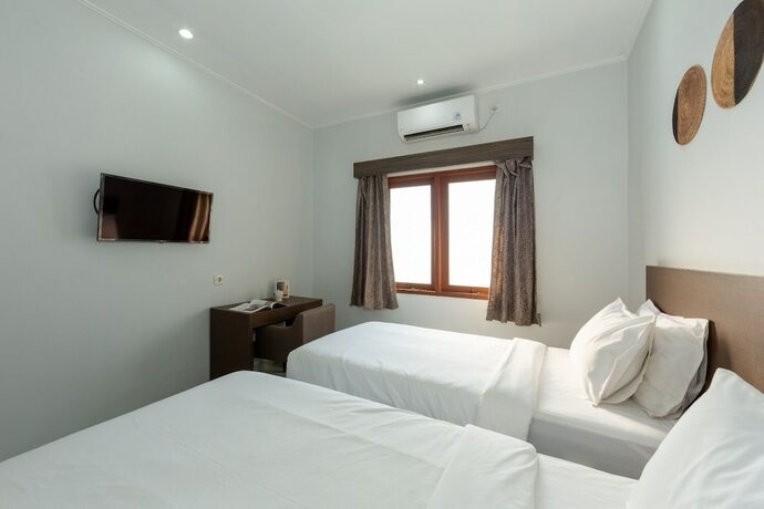 Imagen de la habitación del Hotel Cove Matahari Guesthouse. Foto 14