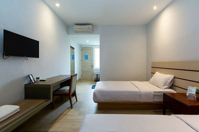 Imagen de la habitación del Hotel Cove Matahari Senja. Foto 15
