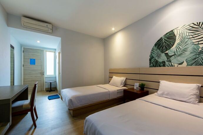 Imagen de la habitación del Hotel Cove Matahari Senja. Foto 17