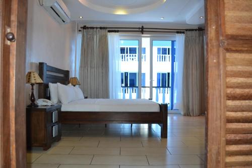 Imagen de la habitación del Hotel Cowrie Shell Beach Apartments. Foto 8
