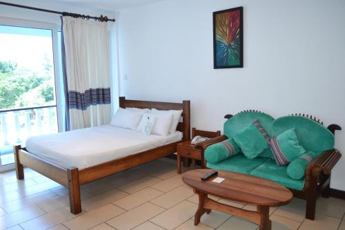 Imagen de la habitación del Hotel Cowrie Shell Beach Apartments. Foto 9