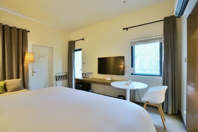 Imagen de la habitación del Hotel Cozi Cottage. Foto 16