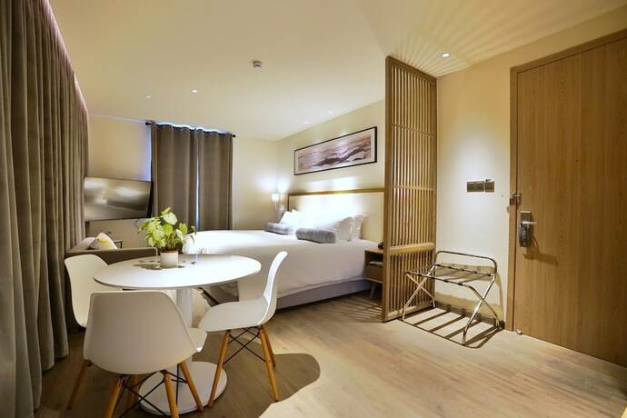 Imagen de la habitación del Hotel Cozi Cottage. Foto 17
