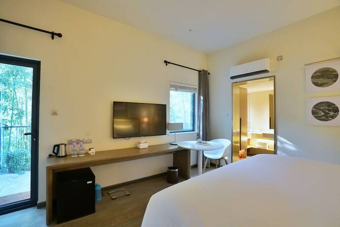 Imagen de la habitación del Hotel Cozi Cottage. Foto 25