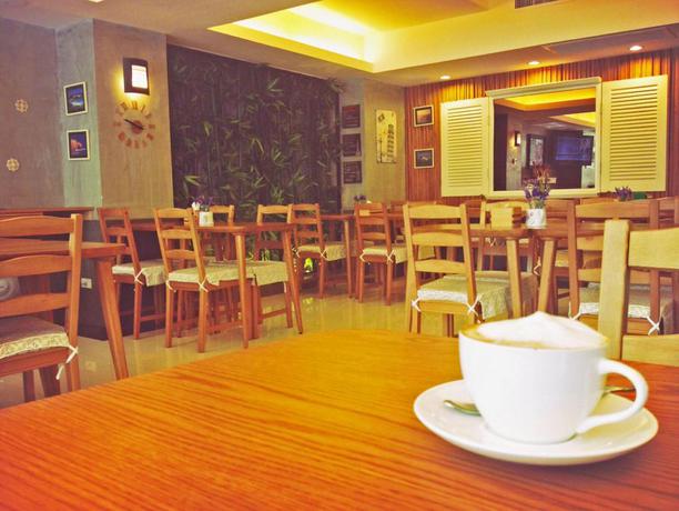 Imagen del bar/restaurante del Hotel Cozy At 9 and Kitchen. Foto 5