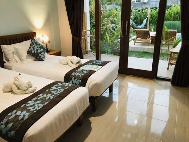 Imagen de la habitación del Hotel Cozy Cottages Lombok. Foto 35