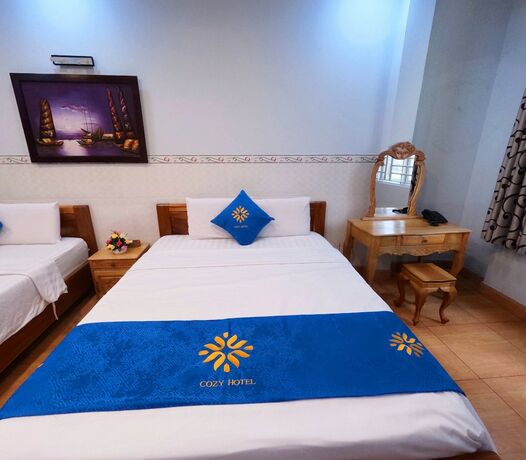 Imagen de la habitación del Hotel Cozy HCM. Foto 17