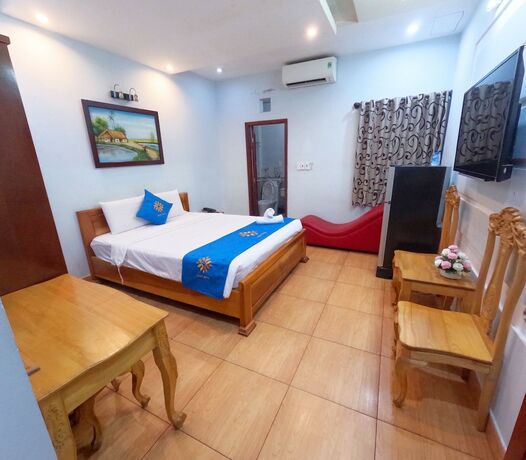 Imagen de la habitación del Hotel Cozy HCM. Foto 19
