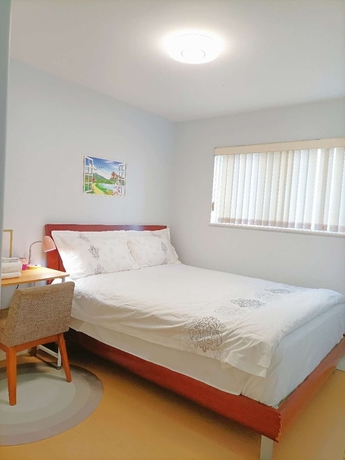 Imagen de la habitación del Hotel Cozy Home in Vancouver. Foto 7