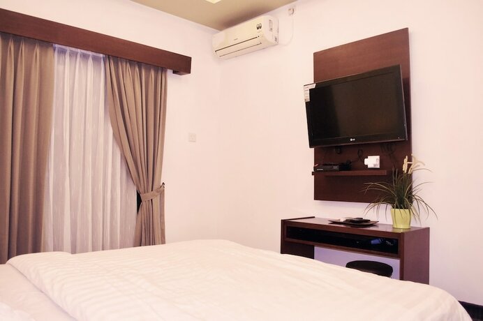 Imagen de la habitación del Hotel Cozy Palm. Foto 12