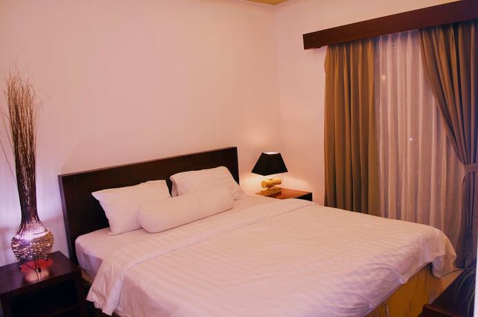 Imagen de la habitación del Hotel Cozy Palm. Foto 22
