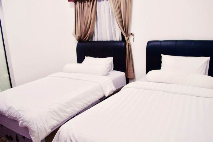 Imagen de la habitación del Hotel Cozy Palm. Foto 34
