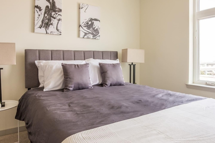 Imagen de la habitación del Hotel CozySuites at Nulu. Foto 12