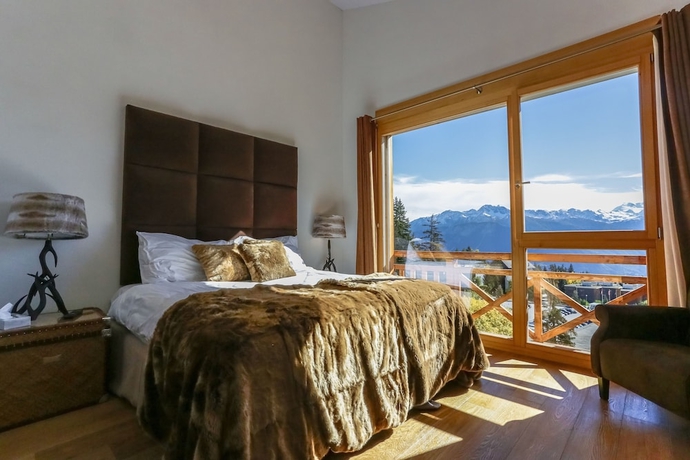 Imagen de la habitación del Hotel Crans Luxury Lodges. Foto 6
