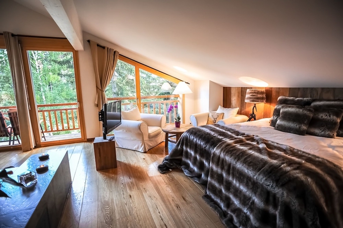 Imagen de la habitación del Hotel Crans Luxury Lodges. Foto 12