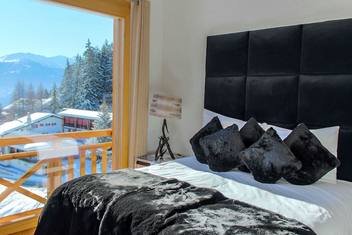 Imagen de la habitación del Hotel Crans Luxury Lodges. Foto 15