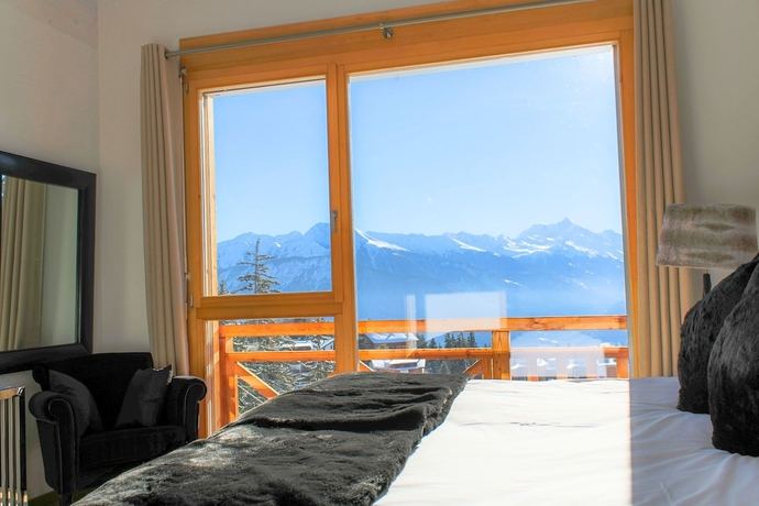 Imagen de la habitación del Hotel Crans Luxury Lodges. Foto 16