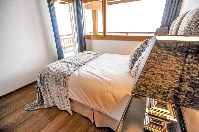 Imagen de la habitación del Hotel Crans Luxury Lodges. Foto 17