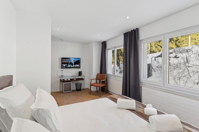 Imagen de la habitación del Hotel Crans Montana Suites. Foto 4