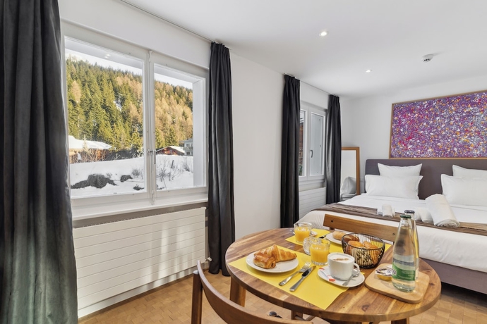 Imagen de la habitación del Hotel Crans Montana Suites. Foto 6