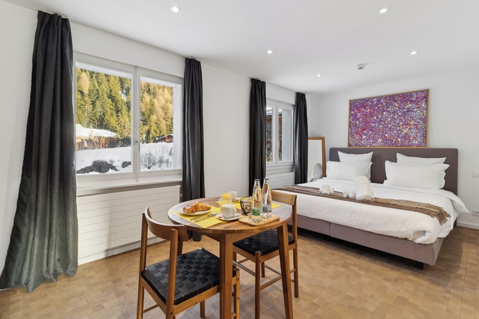 Imagen de la habitación del Hotel Crans Montana Suites. Foto 7