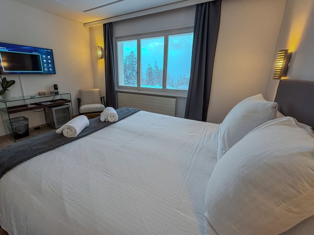 Imagen de la habitación del Hotel Crans Montana Suites. Foto 11