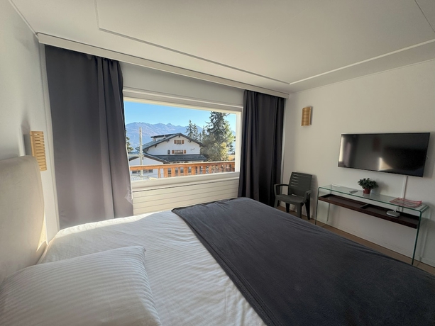 Imagen de la habitación del Hotel Crans Montana Suites. Foto 12