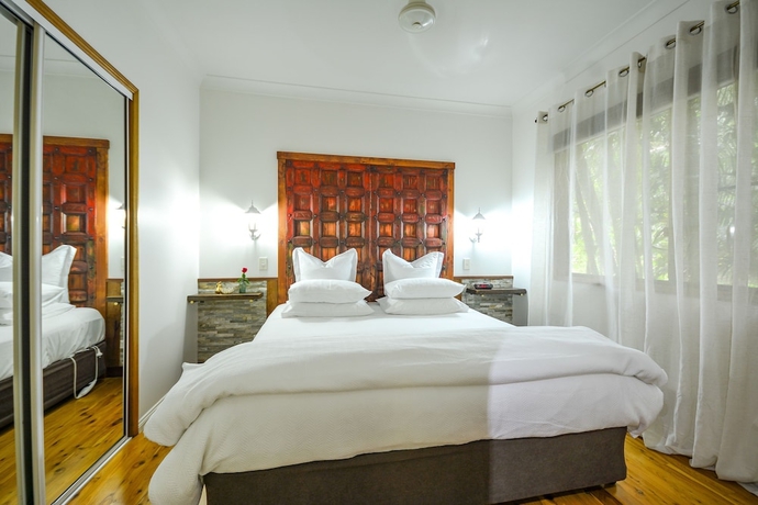 Imagen de la habitación del Hotel Crater Lakes Rainforest Cottages. Foto 4