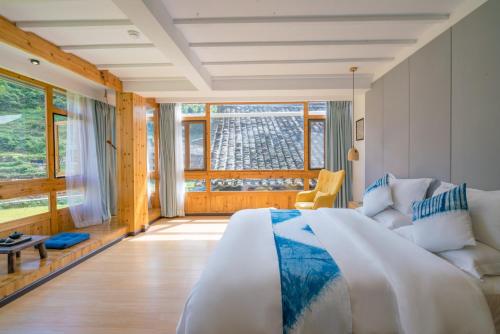 Imagen de la habitación del Hotel Creekside Inn, Liping. Foto 9