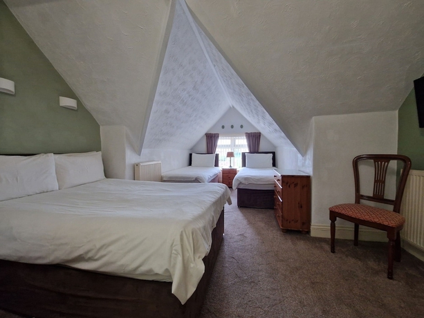 Imagen de la habitación del Hotel Crescent Lodge Guest House. Foto 8