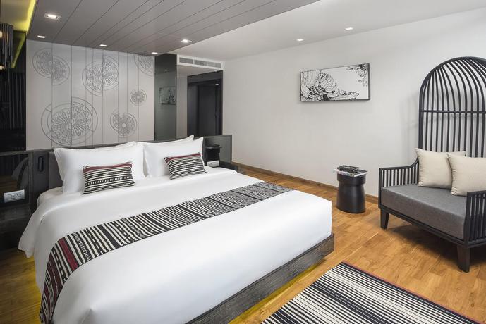 Imagen de la habitación del Hotel Cross Chiang Mai Riverside. Foto 4