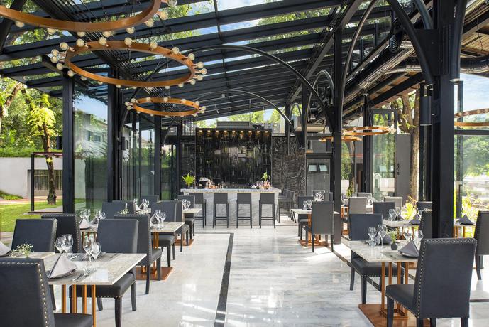 Imagen del bar/restaurante del Hotel Cross Chiang Mai Riverside. Foto 2