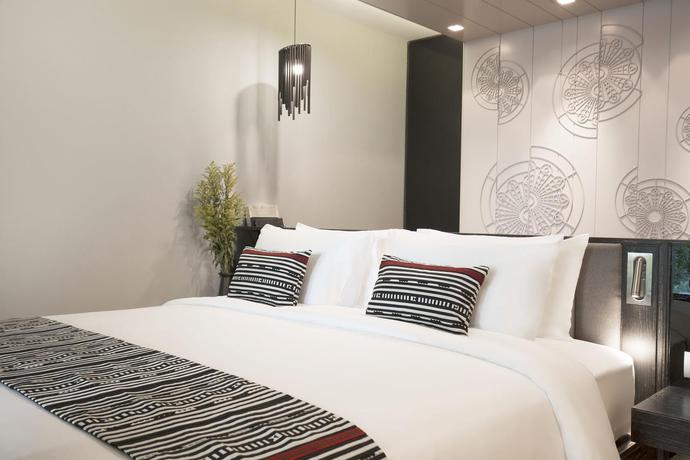 Imagen de la habitación del Hotel Cross Chiang Mai Riverside. Foto 5