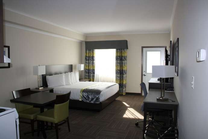 Imagen de la habitación del Hotel Crossroads Inn And Suites. Foto 10