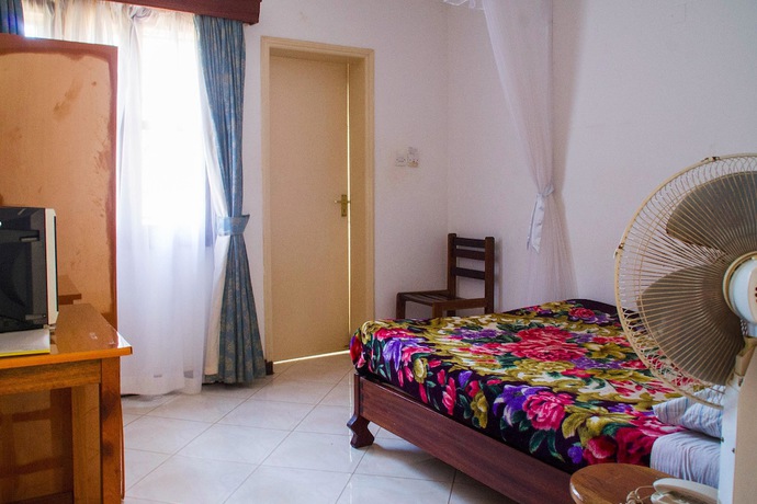 Imagen de la habitación del Hotel Crown Hoima. Foto 19