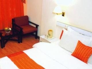 Imagen de la habitación del Hotel Crown Hotel, Ahmedabad. Foto 11