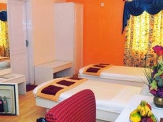Imagen de la habitación del Hotel Crown Hotel, Ahmedabad. Foto 12
