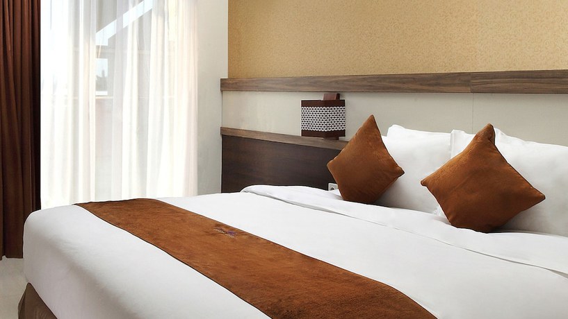 Imagen de la habitación del Hotel Crystal Lotus Yogyakarta. Foto 10