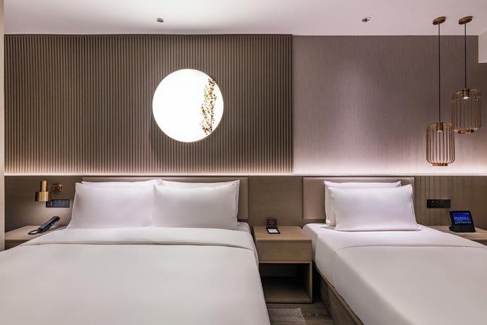 Imagen de la habitación del Hotel Crystal Qingdao MixC Shandong Road. Foto 15